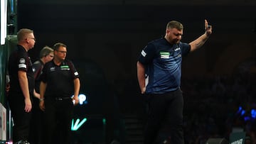 Darts - World Darts Championship - Alexandra Palace, London, Britain - December 15, 2025 Cameron Menzies looks dejected after losing his first round match against Charlie Manby Action Images via Reuters/Matthew Childs