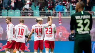 Leipzig&#039;s Slovenian midfielder Kevin Kampl and teammates celebrate scoring  his team&#039;s first goal during the German first division Bundesliga football match between RB Leipzig and Wolfsburg in Leipzig, eastern Germany on April 13, 2019. (Photo b