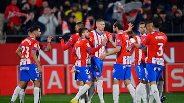 Girona's Ukrainian forward #09 Artem Dovbyk (C) celebrates scoring his team's first goal with teammates during the Spanish league football match between Girona FC and Deportivo Alaves at the Montilivi stadium in Girona on December 18, 2023. (Photo by Pau BARRENA / AFP)