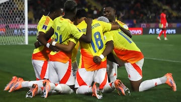 Colombia's midfielder #19 Kener Gonzalez celebrates with teammates after scoring his team's first goal during the 2025 FIFA U-20 World Cup football match between Nigeria and Colombia, at the Fiscal stadium in Talca, Chile, on October 5, 2025. (Photo by RAUL BRAVO / AFP)