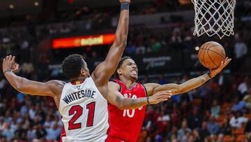 ELX67. MIAMI (EE.UU.), 23/03/2017.- El jugador de Miami Heat Hassan Whiteside (i) en acción ante DeMar DeRozan (d), de Toronto Raptors, durante su partido de baloncesto de la NBA hoy, jueves 23 de marzo de 2017, en el American Airlines Arena de Miami (EE.UU.). EFE/ERIK S. LESSER
