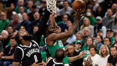 Boston Celtics guard Jaylen Brown goes to the basket on Brooklyn Nets center Andre Drummond and forward Kevin Durant during the first quarter of game two of the first round for the 2022 NBA playoffs at TD Garden.