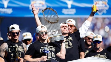 LOS ANGELES, CALIFORNIA - NOVEMBER 01: Enrique Hernandez #8 of the Los Angeles Dodgers speaks while holding the Commissioners' Trophy during the 2024 World Series Celebration Show at Dodger Stadium on November 01, 2024 in Los Angeles, California. Ronald Martinez/Getty Images/AFP (Photo by RONALD MARTINEZ / GETTY IMAGES NORTH AMERICA / Getty Images via AFP)
