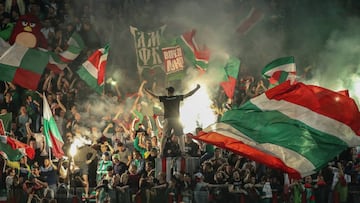 Lokomotiv Moscow fans wave flags and set off firecrackers as they root for their team during the 2017 Russian Super Cup football match against Spartak Moscow at Lokomotiv Stadium. 