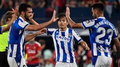 Real Sociedad's Japanese forward Takefusa Kubo (C) celebrates with teammates scoring his team's second goal during the Spanish League football match between CA Osasuna and Real Sociedad at El Sadar stadium in Pamplona on April 28, 2023. (Photo by ANDER GILLENEA / AFP)