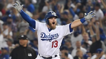 Max Muncy #13 of the Los Angeles Dodgers celebrates his eighteenth inning walk-off home run to defeat the the Boston Red Sox 3-2 in Game Three of the 2018 World Series at Dodger Stadium on October 26, 2018 in Los Angeles, California.   Harry How/Getty