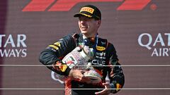 Winner Red Bull Racing's Dutch driver Max Verstappen leaves the podium with his broken trophy after the Formula One Hungarian Grand Prix at the Hungaroring race track in Mogyorod near Budapest on July 23, 2023. (Photo by ATTILA KISBENEDEK / AFP)