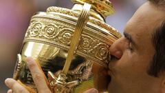 Switzerland&#039;s Roger Federer kisses the trophy after defeating Croatia&#039;s Marin Cilic to win the Men&#039;s Singles final match on day thirteen at the Wimbledon Tennis Championships in London Sunday, July 16, 2017.. (AP Photo/Alastair Grant)