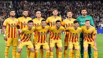 Players of team Girona pose before the Spanish league football match between FC Barcelona and Girona FC at the Camp Nou stadium in Barcelona on April 10, 2023. (Photo by Pau BARRENA / AFP)