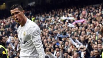 Real Madrid's Portuguese forward Cristiano Ronaldo celebrates after scoring during the Spanish league football match Real Madrid CF vs Athletic Club Bilbao at the Santiago Bernabeu stadium in Madrid on February 13, 2016. / AFP / GERARD JULIEN