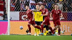 Serbia's forward Luka Jovic (L) celebrates scoring the opening goal with his teammates during the UEFA Nations League football match Sweden v Serbia in Solna, Sweden on June 9, 2022. (Photo by Claudio BRESCIANI / TT NEWS AGENCY / AFP) / Sweden OUT