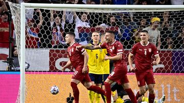 Serbia's forward Luka Jovic (L) celebrates scoring the opening goal with his teammates during the UEFA Nations League football match Sweden v Serbia in Solna, Sweden on June 9, 2022. (Photo by Claudio BRESCIANI / TT NEWS AGENCY / AFP) / Sweden OUT