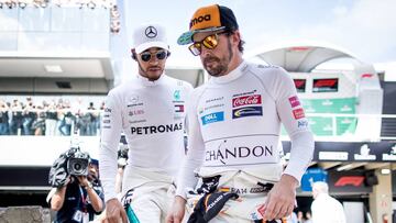 SAO PAULO, BRAZIL - NOVEMBER 11:  Fernando Alonso of Spain and McLaren F1 and Lewis Hamilton of Great Britain and Mercedes GP walk to the grid before the Formula One Grand Prix of Brazil at Autodromo Jose Carlos Pace on November 11, 2018 in Sao Paulo, Brazil.  (Photo by Lars Baron/Getty Images)