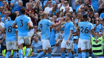 Manchester City's Belgian midfielder Kevin De Bruyne (R) celebrates with teammates after scoring his team second goal during the English Premier League football match between Manchester City and Bournemouth at the Etihad Stadium in Manchester, north west England, on August 13, 2022. - RESTRICTED TO EDITORIAL USE. No use with unauthorized audio, video, data, fixture lists, club/league logos or 'live' services. Online in-match use limited to 120 images. An additional 40 images may be used in extra time. No video emulation. Social media in-match use limited to 120 images. An additional 40 images may be used in extra time. No use in betting publications, games or single club/league/player publications. (Photo by Oli SCARFF / AFP) / RESTRICTED TO EDITORIAL USE. No use with unauthorized audio, video, data, fixture lists, club/league logos or 'live' services. Online in-match use limited to 120 images. An additional 40 images may be used in extra time. No video emulation. Social media in-match use limited to 120 images. An additional 40 images may be used in extra time. No use in betting publications, games or single club/league/player publications. / RESTRICTED TO EDITORIAL USE. No use with unauthorized audio, video, data, fixture lists, club/league logos or 'live' services. Online in-match use limited to 120 images. An additional 40 images may be used in extra time. No video emulation. Social media in-match use limited to 120 images. An additional 40 images may be used in extra time. No use in betting publications, games or single club/league/player publications. (Photo by OLI SCARFF/AFP via Getty Images)