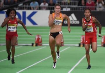 The USA's Barbara Pierre (L) races to win the 60 meters race at the IAAF World Indoor athletic championships in Portland, Oregon on March 19, 2016. / AFP PHOTO / Mark Ralston