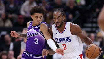 Dec 8, 2023; Salt Lake City, Utah, USA; Los Angeles Clippers forward Kawhi Leonard (2) brings the ball up the court against Utah Jazz guard Keyonte George (3) during the second half at Delta Center. Mandatory Credit: Rob Gray-USA TODAY Sports