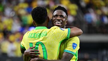 Brazil's forward #07 Vinicius Junior (R) celebrates with Brazil's forward #10 Rodrygo after scoring his team's third goal during the Conmebol 2024 Copa America tournament group D football match between Paraguay and Brazil at Allegiant Stadium in Las Vegas, Nevada on June 28, 2024. (Photo by Frederic J. Brown / AFP)