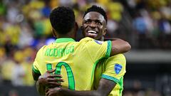 Brazil's forward #07 Vinicius Junior (R) celebrates with Brazil's forward #10 Rodrygo after scoring his team's third goal during the Conmebol 2024 Copa America tournament group D football match between Paraguay and Brazil at Allegiant Stadium in Las Vegas, Nevada on June 28, 2024. (Photo by Frederic J. Brown / AFP)