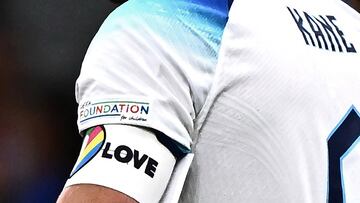 (FILES) In this file photo taken on September 24, 2022, England's forward Harry Kane wearing a rainbow armband. reacts after losing the UEFA Nations League's League A Group 3 match between Italy and England, at the San Siro Stadium in Milan. - England, Germany and five other European teams at the World Cup on Monday, November 21, abandoned plans to wear a rainbow-themed armband in support of LGBTQ rights, citing the threat of disciplinary action from FIFA. The "OneLove" armband due to be warn by the likes of England captain Harry Kane and Germany counterpart Manuel Neuer is designed as part of a campaign to promote inclusivity. (Photo by Marco BERTORELLO / AFP)