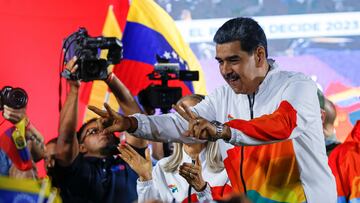 Venezuela's President Nicolas Maduro gestures at supporters, during an electoral referendum over Venezuela's rights to the potentially oil-rich region of Esequiba, which has long been the subject of a border dispute between Venezuela and Guyana, in Caracas, Venezuela, December 3, 2023. REUTERS/Leonardo Fernandez Viloria