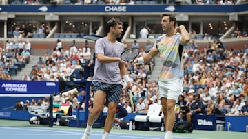 NEW YORK, NEW YORK - SEPTEMBER 06: (L-R) Horacio Zeballos of Argentina celebrates with Marcel Granollers of Spain against Neal Skupski of the United Kingdom and Joe Salisbury of the United Kingdom during their Men's Doubles Final match on Day Fourteen of the 2025 US Open at USTA Billie Jean King National Tennis Center on September 06, 2025 in New York City. Al Bello/Getty Images/AFP (Photo by AL BELLO / GETTY IMAGES NORTH AMERICA / Getty Images via AFP)