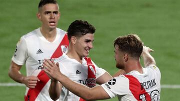 River Plate&#039;s forward Lucas Beltran (R) celebrates with his teammates River Plate&#039;s Colombian forwards Rafael Borre (L) and Julian Alvarez after scoring a goal against Colon during their Argentine Professional Football League match at the Monume