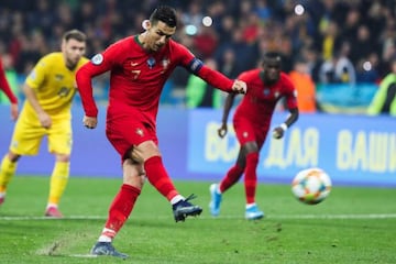 Portugal's Cristiano Ronaldo brings up his 700th career goal from the penalty spot against Ukraine.