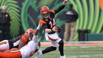 CINCINNATI, OH - NOVEMBER 25: Andy Dalton #14 of the Cincinnati Bengals slips out of an attempted tackle by Myles Garrett #95 of the Cleveland Browns during the second quarter at Paul Brown Stadium on November 25, 2018 in Cincinnati, Ohio. John Grieshop/Getty Images/AFP
== FOR NEWSPAPERS, INTERNET, TELCOS & TELEVISION USE ONLY ==