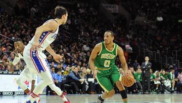 Mar 19, 2017; Philadelphia, PA, USA; Boston Celtics guard Avery Bradley (0) dribbles the ball as Philadelphia 76ers forward Dario Saric (9) defends during the first quarter of the game at the Wells Fargo Center. Mandatory Credit: John Geliebter-USA TODAY Sports