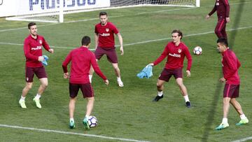 Gabi, Koke, Griezmann, Saúl y Correa, durante el entrenamiento.