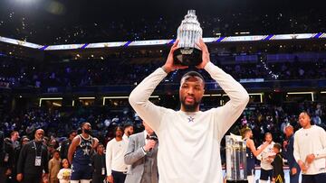 INDIANAPOLIS, INDIANA - FEBRUARY 18: Damian Lillard #0 of the Milwaukee Bucks lifts the Kobe Bryant All-Star MVP trophy during the 2024 NBA All-Star Game at Gainbridge Fieldhouse on February 18, 2024 in Indianapolis, Indiana. NOTE TO USER: User expressly acknowledges and agrees that, by downloading and or using this photograph, User is consenting to the terms and conditions of the Getty Images License Agreement.   Stacy Revere/Getty Images/AFP (Photo by Stacy Revere / GETTY IMAGES NORTH AMERICA / Getty Images via AFP)