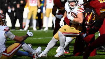 Dec 31, 2023; Landover, Maryland, USA; San Francisco 49ers running back Christian McCaffrey (23) carries the ball against the Washington Commanders during the first half at FedExField. Mandatory Credit: Brad Mills-USA TODAY Sports