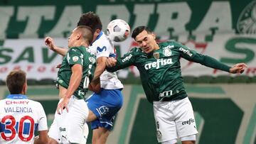 Soccer Football - Copa Libertadores - Round of 16 - Second leg -  Palmeiras v Universidad Catolica - Allianz Parque, Sao Paulo, Brazil - July 21, 2021 Palmeiras&#039; Gustavo Gomez in action with Universidad Catolica&#039;s Alfonso Parot Pool via REUTERS/