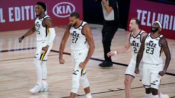 Aug 19, 2020; Lake Buena Vista, Florida, USA; Utah Jazz&#039;s Rudy Gobert (27) celebrates a defensive stop with teammates Royce O&#039;Neale (23), Joe Ingles (2) and Donovan Mitchell (45) during the first half of an NBA basketball first round playoff game against the Denver Nuggets. Mandatory Credit: Ashley Landis/Pool Photo via USA TODAY Sports