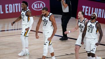 Aug 19, 2020; Lake Buena Vista, Florida, USA; Utah Jazz's Rudy Gobert (27) celebrates a defensive stop with teammates Royce O'Neale (23), Joe Ingles (2) and Donovan Mitchell (45) during the first half of an NBA basketball first round playoff game against the Denver Nuggets. Mandatory Credit: Ashley Landis/Pool Photo via USA TODAY Sports