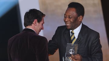 (FILES) In this file photo taken on January 09, 2012 Barcelona&#039;s Argentinian forward Lionel Messi (L) receives from Brazilian football legend Pele the FIFA/FIFPro World XI award at the Kongresshaus in Zurich during the FIFA Ballon d&#039;Or event. - 