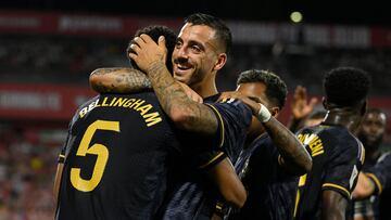 Real Madrid's English midfielder #5 Jude Bellingham celebrates with Real Madrid's Spanish forward #14 Joselu after scoring his team's third goal during the Spanish Liga football match between Girona FC and Real Madrid CF at the Montilivi stadium in Girona on September 30, 2023. (Photo by Josep LAGO / AFP)