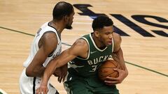 MILWAUKEE, WISCONSIN - MAY 02: Giannis Antetokounmpo #34 of the Milwaukee Bucks is defended by Kevin Durant #7 of the Brooklyn Nets during the second half of a game at Fiserv Forum on May 02, 2021 in Milwaukee, Wisconsin. NOTE TO USER: User expressly acknowledges and agrees that, by downloading and or using this photograph, User is consenting to the terms and conditions of the Getty Images License Agreement.   Stacy Revere/Getty Images/AFP
 == FOR NEWSPAPERS, INTERNET, TELCOS &amp; TELEVISION USE ONLY ==