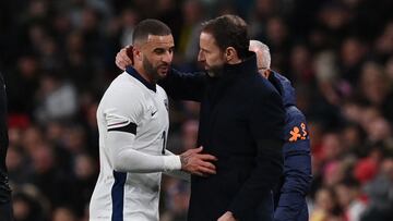 England's defender #02 Kyle Walker (L) is consoled by England's manager Gareth Southgate (R) after having to leave the game after picking up an injury during the international friendly football match between England and Brazil at Wembley stadium in north London on March 23, 2024. (Photo by Glyn KIRK / AFP) / NOT FOR MARKETING OR ADVERTISING USE / RESTRICTED TO EDITORIAL USE