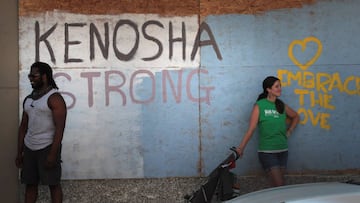 A message is painted on the boarded up door to a business in the city&#039;s business district on August 27, 2020 in Kenosha, Wisconsin.