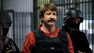 FILE PHOTO: Suspected Russian arms dealer Viktor Bout is escorted by members of a special police unit after a hearing at a criminal court in Bangkok October 5, 2010. REUTERS/Sukree Sukplang/File Photo