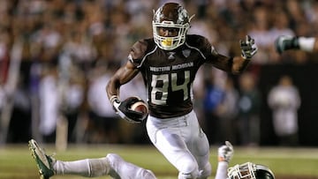 Sep 4, 2015; Kalamazoo, MI, USA; Western Michigan Broncos wide receiver Corey Davis (84) runs though the tackle of Michigan State Spartans linebacker Darien Harris (45) during the 2nd half of a game at Waldo Stadium. Mandatory Credit: Mike Carter-USA TODAY Sports