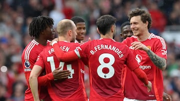 Manchester United's Danish midfielder #14 Christian Eriksen (2L) celebrates with teammates after scoring their second goal from the penalty spot during the English Premier League football match between Manchester United and Aston Villa at Old Trafford in Manchester, north west England, on May 25, 2025. (Photo by Darren Staples / AFP) / RESTRICTED TO EDITORIAL USE. No use with unauthorized audio, video, data, fixture lists, club/league logos or 'live' services. Online in-match use limited to 120 images. An additional 40 images may be used in extra time. No video emulation. Social media in-match use limited to 120 images. An additional 40 images may be used in extra time. No use in betting publications, games or single club/league/player publications. /