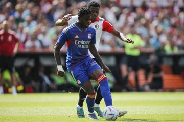 ROTTERDAM - (lr) Castello Lukeba of Olympique Lyonnais, Javairo Dilrosun of Feyenoord during the friendly match between Feyenoord and Olympique Lyon at Feyenoord Stadium de Kuip on July 24, 2022 in Rotterdam, Netherlands. ANP BART STOUTJEDIJK (Photo by ANP via Getty Images)