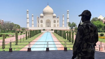 FILE PHOTO: A member of Central Industrial Security Force (CISF) personnel stands guard inside the empty premises of the historic Taj Mahal during a 21-day nationwide lockdown to slow the spread of COVID-19, in Agra, India, April 2, 2020. REUTERS/Sunil Ka