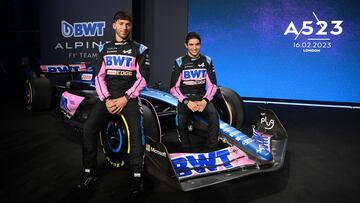 French drivers Pierre Gasly (L) and Esteban Ocon pose with their new BWT Alpine A523 Formula One racing car during the team's 2023 season launch, in London on February 16, 2023. (Photo by Daniel LEAL / AFP)