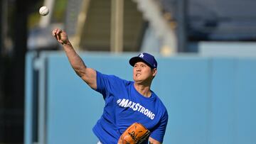 Aug 23, 2024; Los Angeles, California, USA; Los Angeles Dodgers designated hitter Shohei Ohtani (17) goes through his throwing routine prior to the game against the Tampa Bay Rays at Dodger Stadium. Mandatory Credit: Jayne Kamin-Oncea-USA TODAY Sports