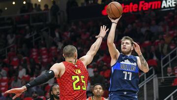 Oct 24, 2018; Atlanta, GA, USA; Dallas Mavericks guard Luka Doncic (77) shoots over Atlanta Hawks center Alex Len (25) during the first quarter at Philips Arena. Mandatory Credit: Dale Zanine-USA TODAY Sports