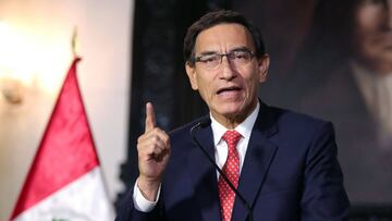 Handout picture released by the Peruvian Presidency showing President Martin Vizcarra giving a televised message to the nation in Lima, on September 10, 2020, amid a political crisis for allegadly trying to obstruct a graft probe involving government officials. - A debate open in the Peruvian Congress on September 11, 2020 on whether to open impeachment proceedings against Vizcarra for alleged "moral incapacity". The debate comes the day after the broadcast of an audio recording of him trying to persuade witnesses to cover up the truth in a corruption probe. Vizcarra denounces "a plot". (Photo by Carla PATINO / Peruvian Presidency / AFP) / RESTRICTED TO EDITORIAL USE - MANDATORY CREDIT "AFP PHOTO / PERU'S PRESIDENCY / CARLA PATINO" - NO MARKETING - NO ADVERTISING CAMPAIGNS - DISTRIBUTED AS A SERVICE TO CLIENTS