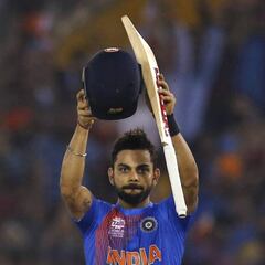 Kohli dazzles to propel India into World T20 semis